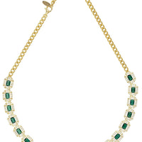 Gold-tone tennis necklace with emerald-green square gemstones and link chain