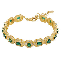 Gold-tone gemstone bracelet with emerald-green stones and faceted, rectangular settings