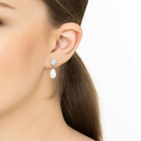 Silver earrings with round sparkle studs and teardrop white pearl drops