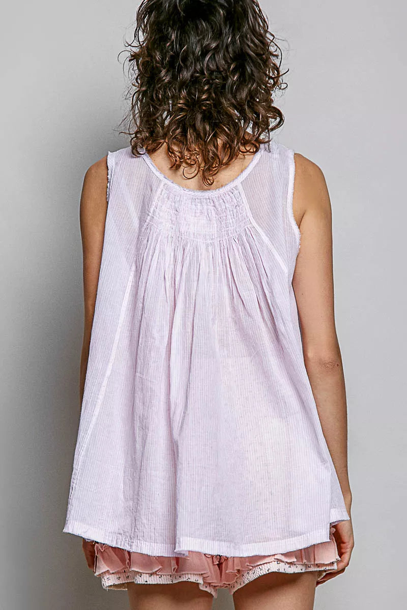 Lavender sleeveless cotton top with round neck, gathered pleats, and flared hem