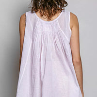 Lavender sleeveless cotton top with round neck, gathered pleats, and flared hem
