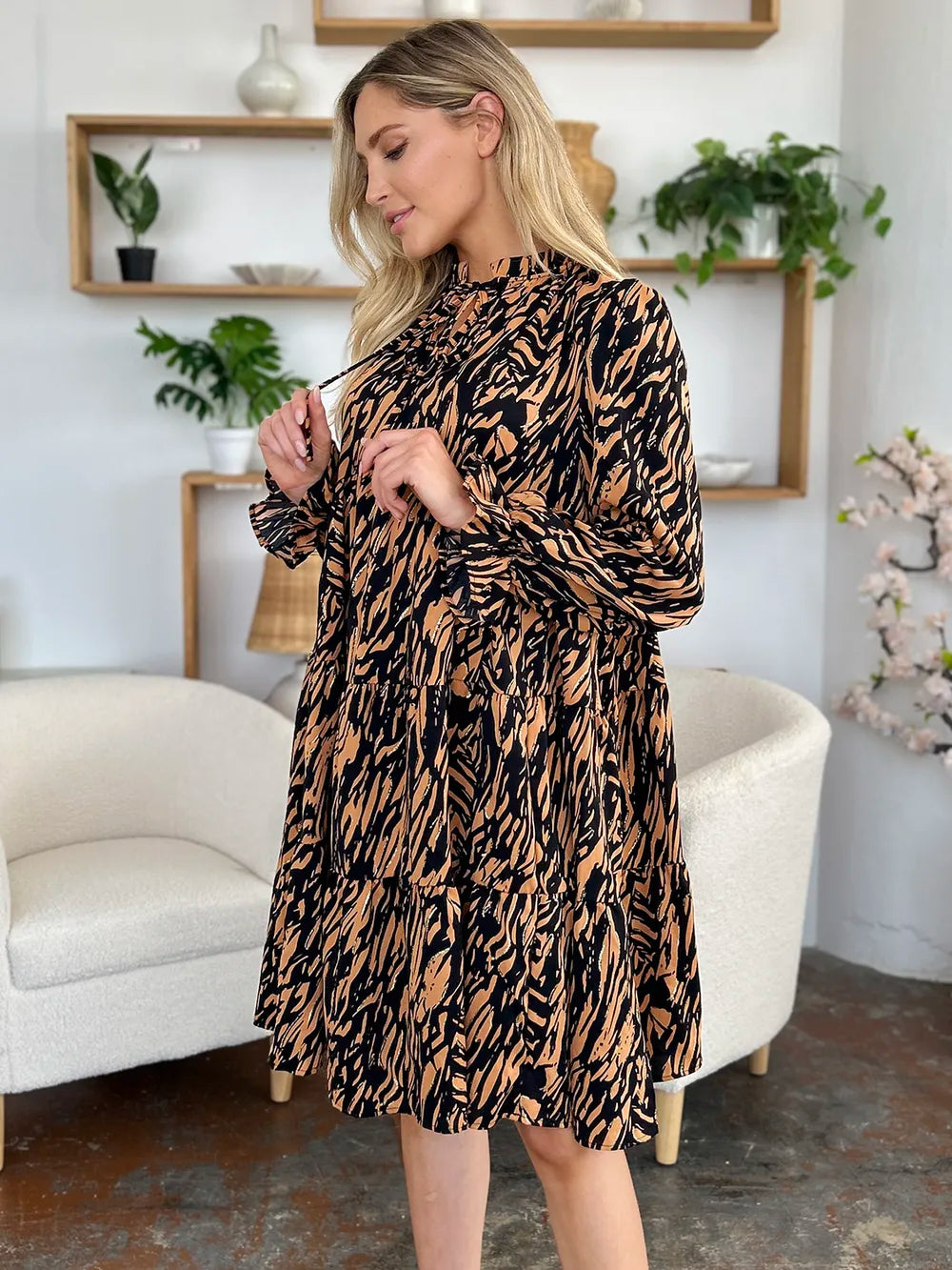 Caramel and black printed ruffle-hem long-sleeve dress, plus size, angled view