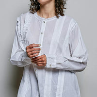 Ivory lightweight woven shirt with ruffle trim round neck and button front, full view