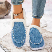 Light blue faux fur lined round toe slip-on shoes with white trim and stitched seams