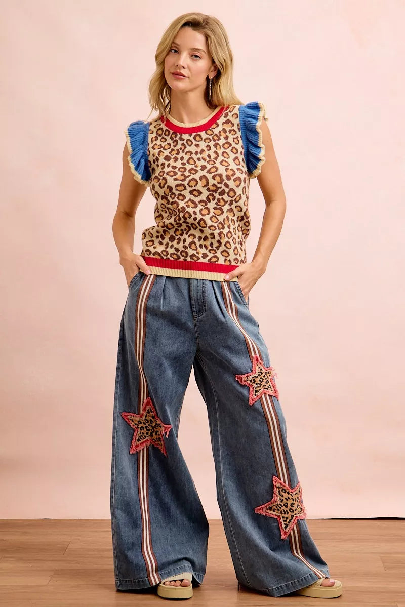 Leopard print sleeveless knit top with blue ruffled sleeves and red neckline trim
