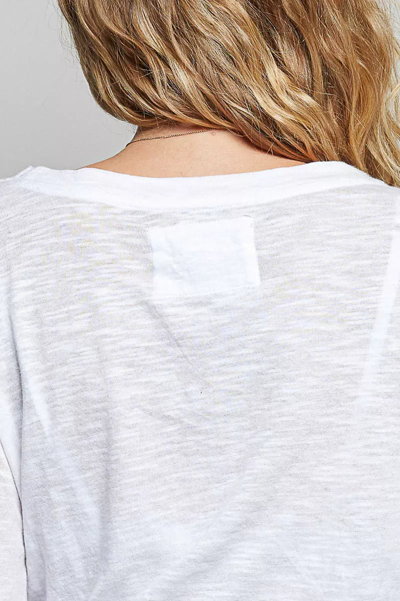 Off-white lightweight knit long-sleeve top with plain back panel