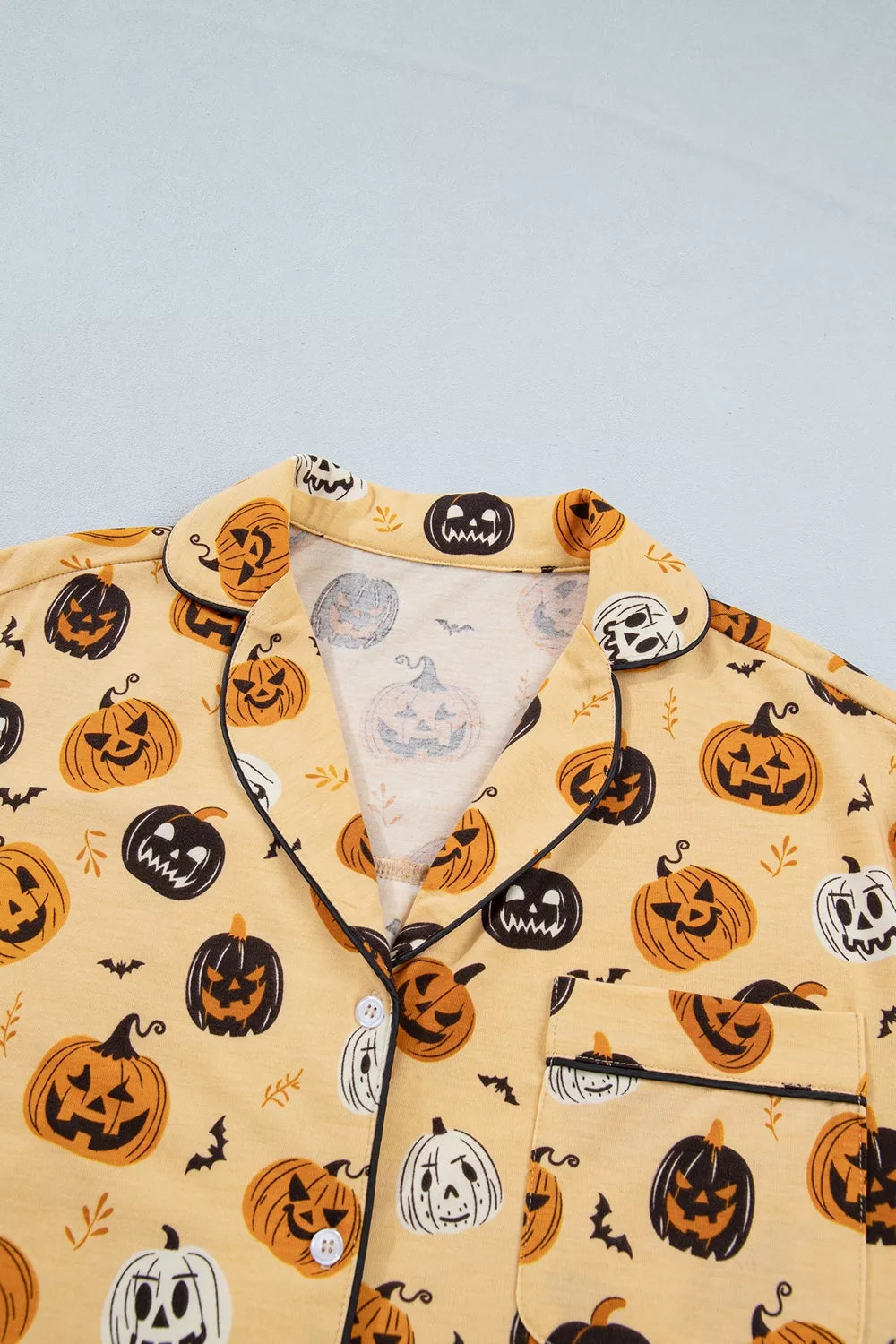 Gold Halloween pumpkin print long-sleeve top, notch collar with button placket