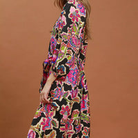 Black abstract print belted midi dress, side view, V-neck and long puff sleeves