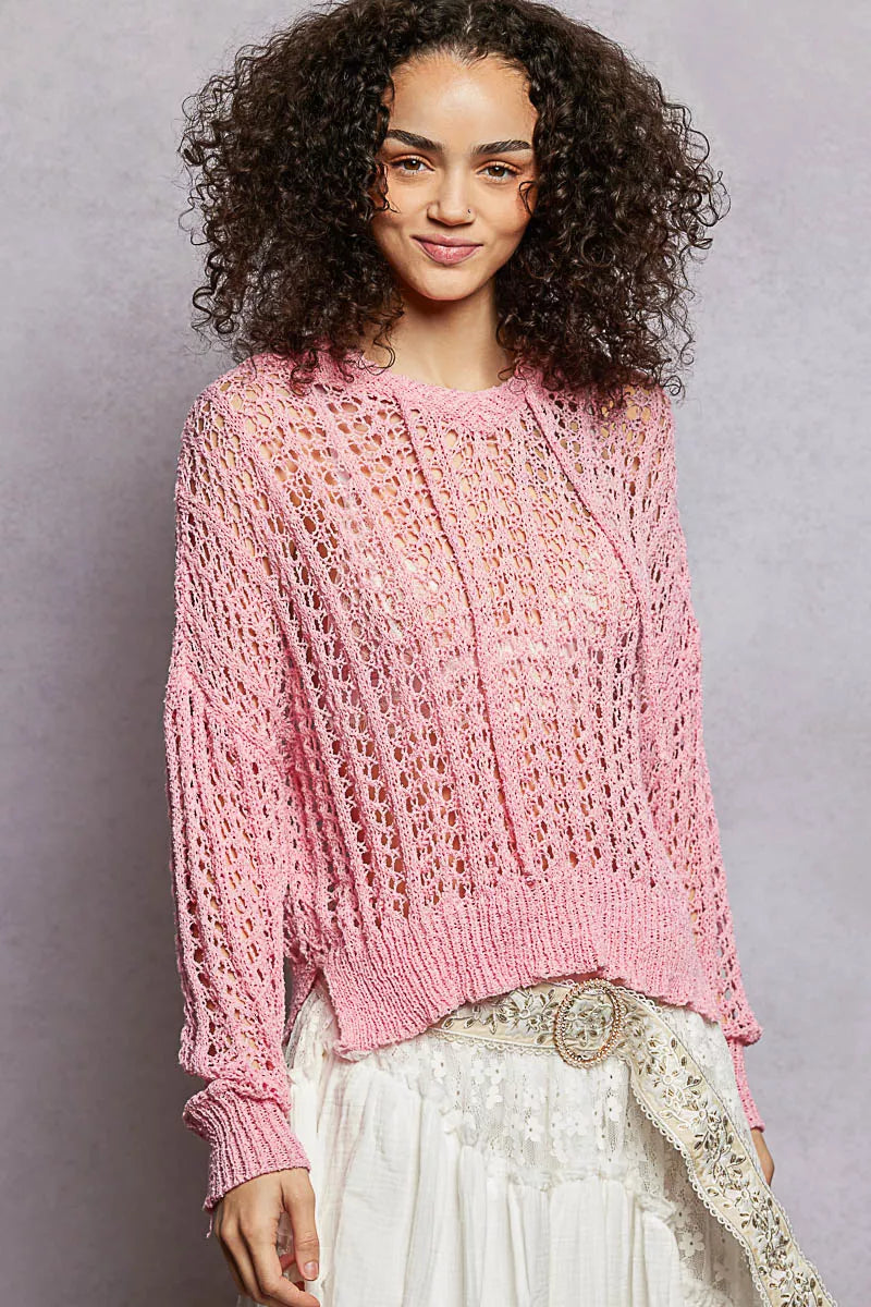 Pink openwork knit top with round neck and long sleeves, high-low hem