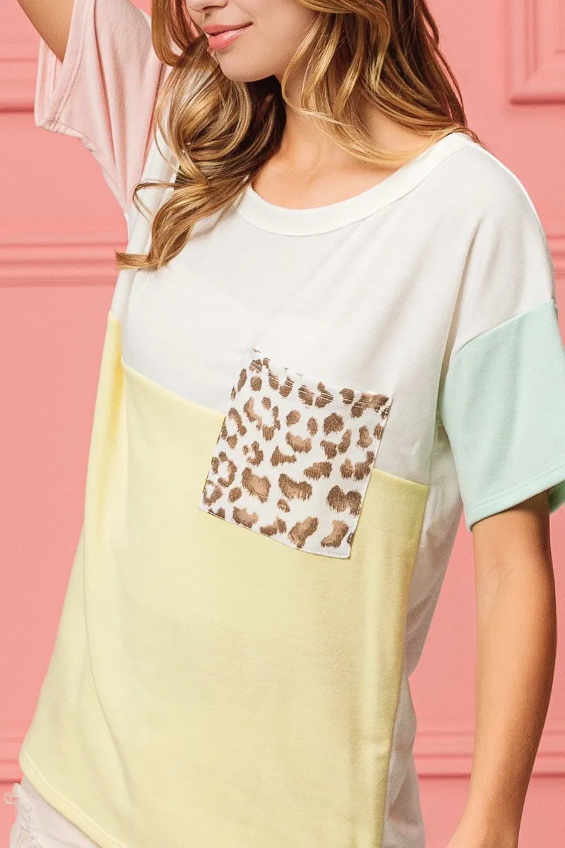 Color block crew neck top with leopard print chest pocket and mint side sleeve panel
