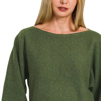 Dark olive boat-neck sweater with relaxed, wide sleeves in textured knit