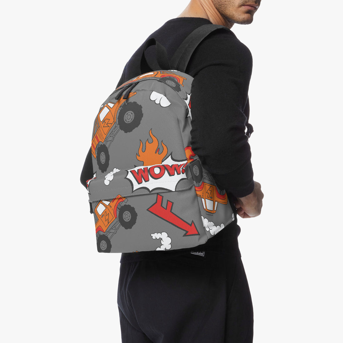 Grey monster truck backpack worn on front, orange flame and WOW logo graphics