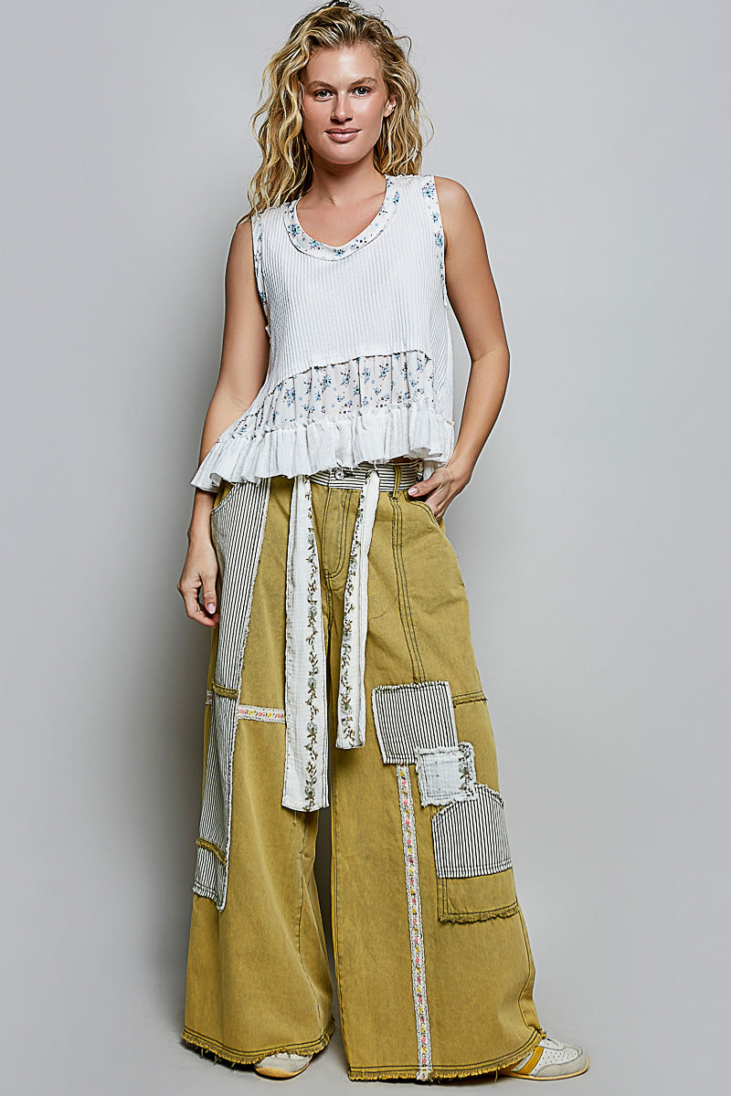 Off-white ribbed tank top with floral band and gathered ruffle hem