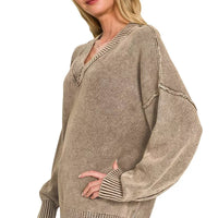 Brown washed oversized sweater with deep V-neck, long sleeves, ribbed hem