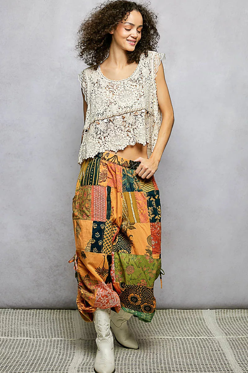 Patchwork wide-leg printed pants with gathered elastic waist and side drawstring ties
