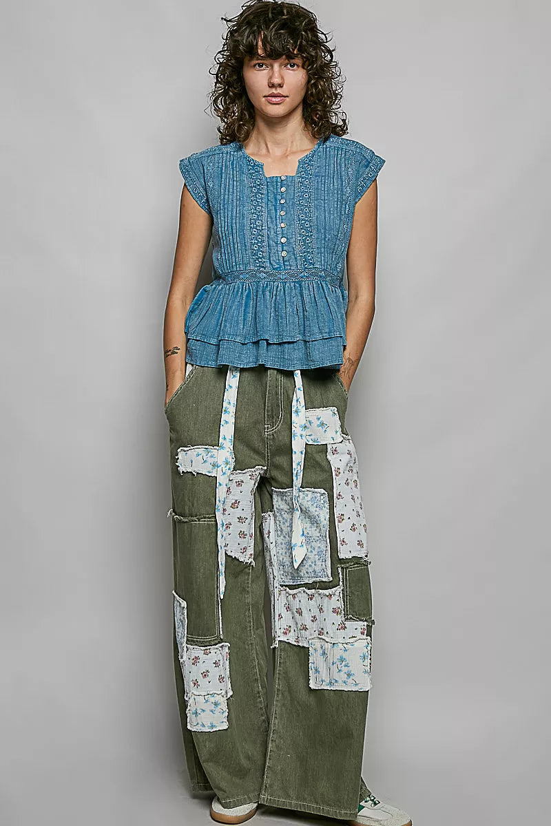 Denim blue sleeveless embroidered pintuck peplum blouse with button front