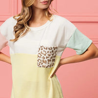 Color block crew neck top with leopard pocket at chest and pale mint sleeve panel