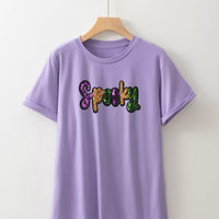 Lavender T-shirt with sequined 'Spooky' letter graphic on front, short sleeves