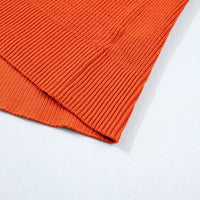Orange ribbed knit sweater sleeve cuff and hem detail