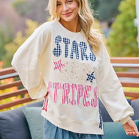Cream crewneck sweatshirt with stars-and-stripes patch-style graphic, relaxed fit