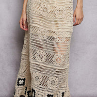 Crochet maxi skirt in natural with textured stitch panels and black granny-square hem