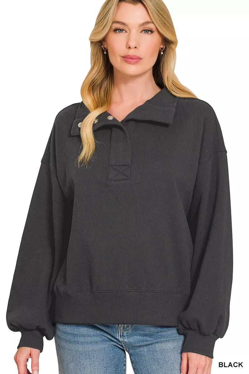 Black fleece half-snap sweatshirt, half-button placket and relaxed neckline