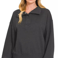 Black fleece half-snap sweatshirt, half-button placket and relaxed neckline