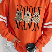 Orange crewneck pullover sweatshirt with spooky season ghost graphic