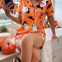 Orange Halloween lounge set with button-down short-sleeve shirt and printed matching shorts