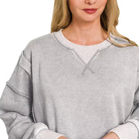 Gray acid-washed fleece pullover with contrast-trim neckline and long sleeves