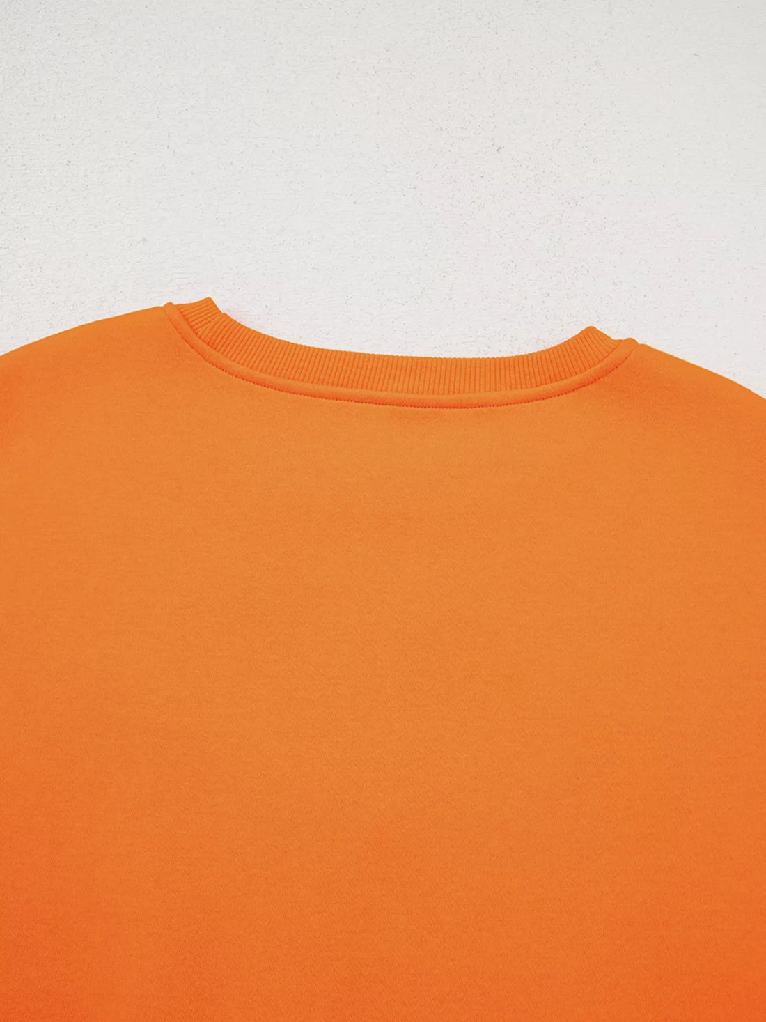 Orange crewneck sweatshirt with ribbed neckline, plain front, no visible graphic