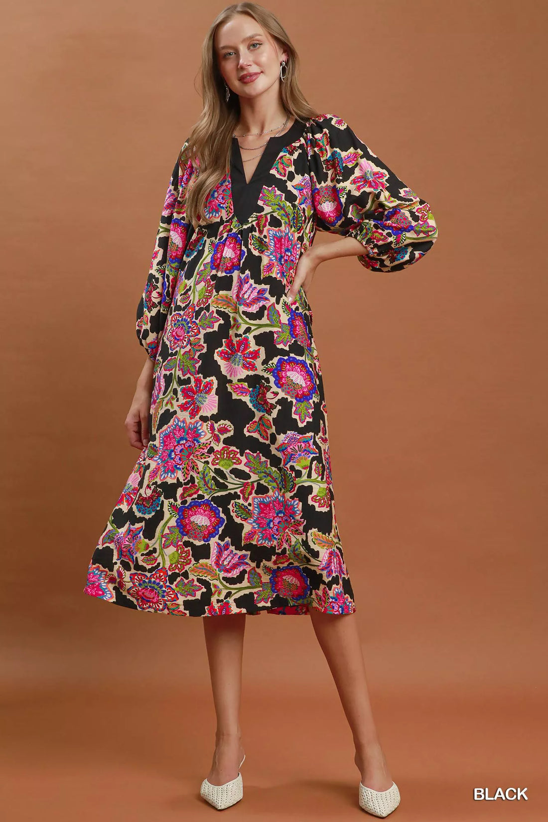 Black abstract print belted midi dress with V-neck and long puff sleeves, standing view