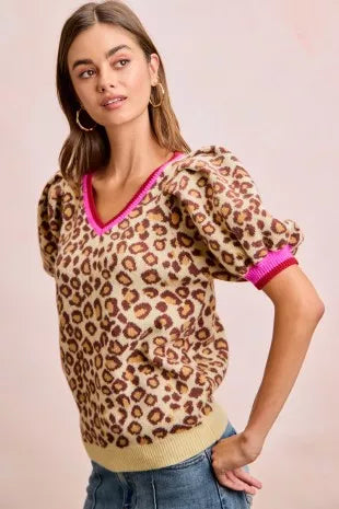 Leopard print V-neck sweater with puff sleeves and hot pink ribbed cuffs