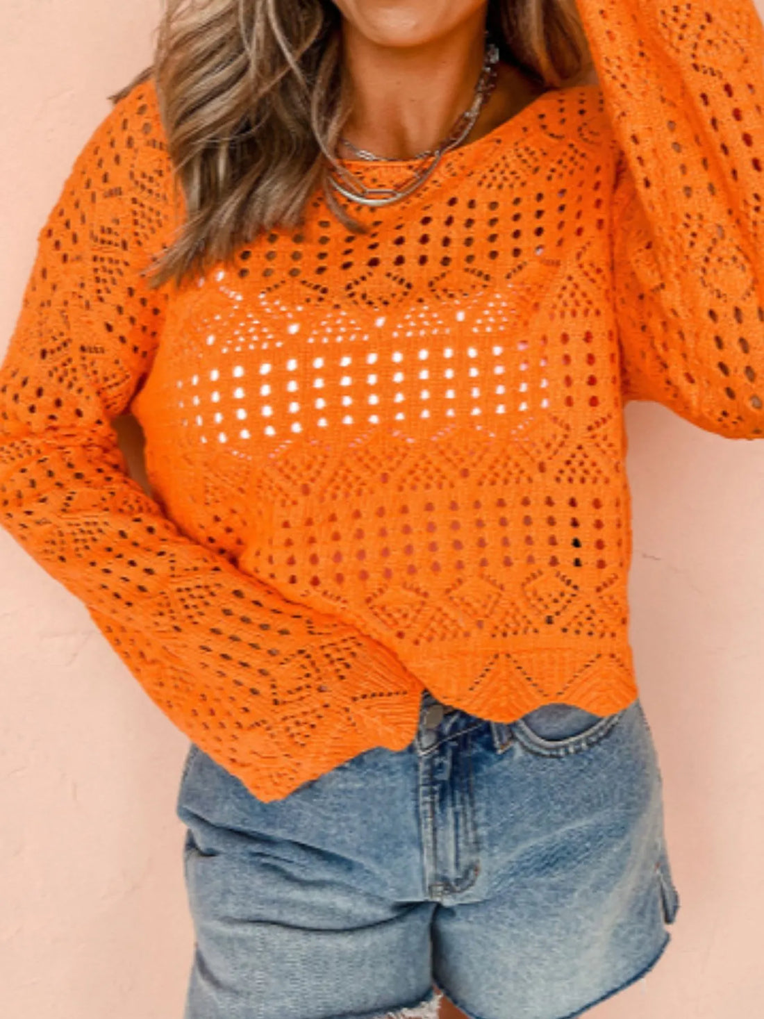 Orange crochet boat-neck knit cover-up with openwork eyelet rows and long sleeves