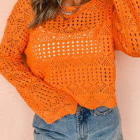 Orange crochet boat-neck knit cover-up with openwork eyelet rows and long sleeves