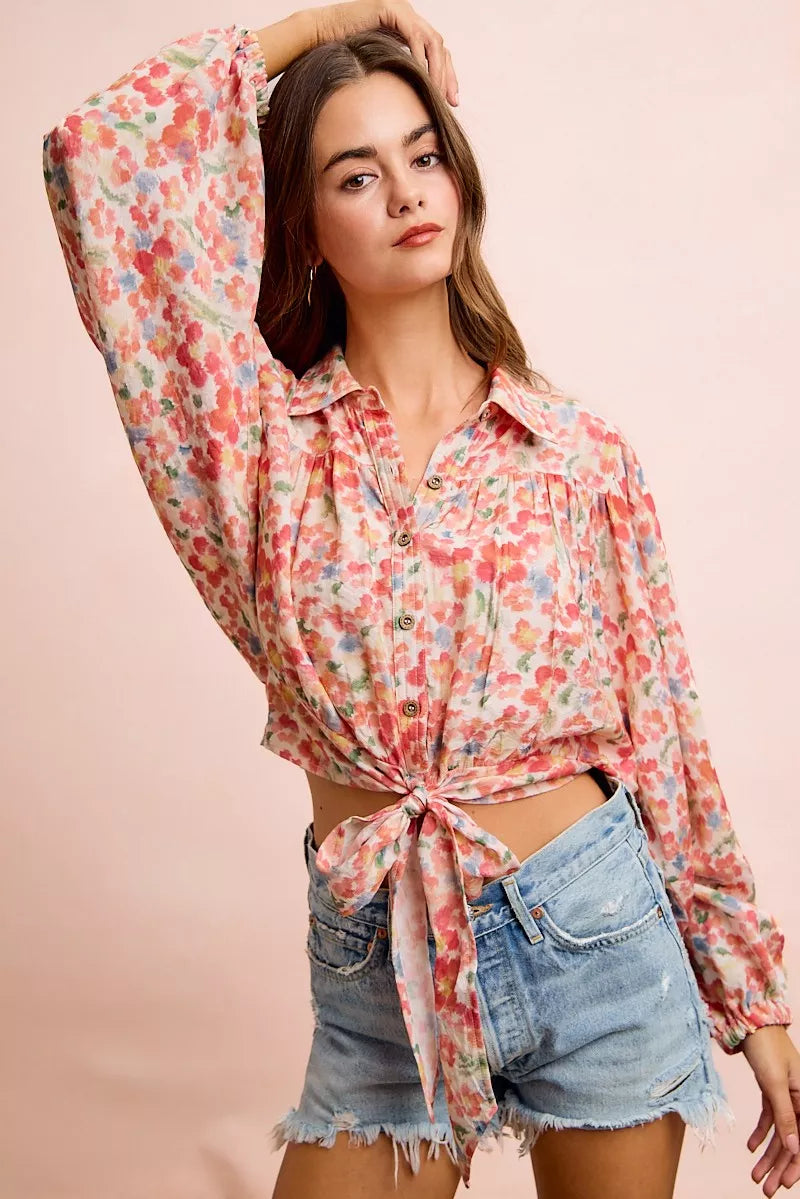Floral print crop shirt with button front, puff sleeves, and tied hem knot