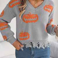 Gray V-neck sweater with orange pumpkin knit and distressed, frayed bottom hem