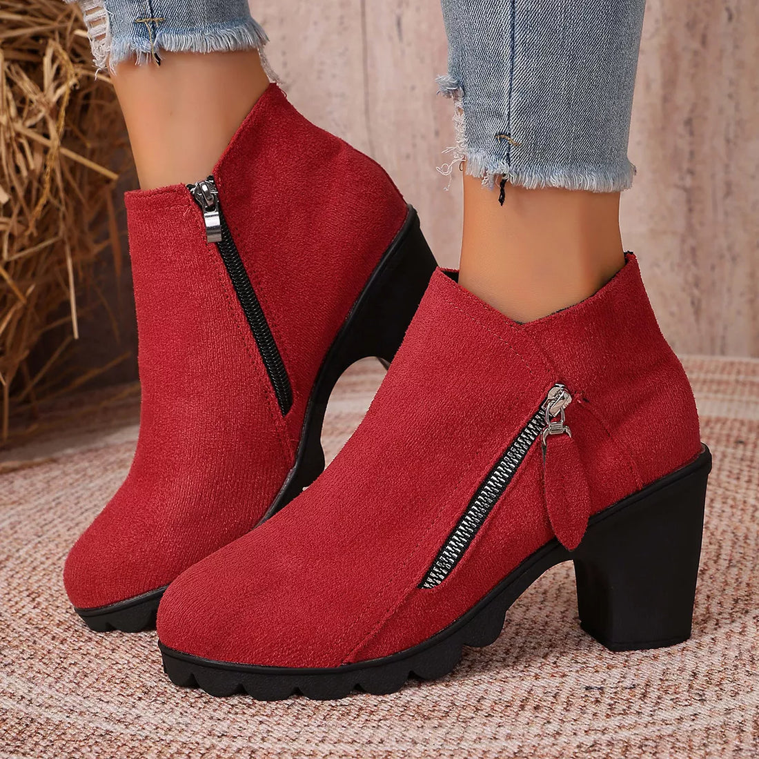 Red suede block-heel ankle boots with round toe and side zipper closure