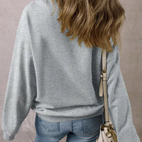 Gray oversized pullover sweatshirt, back view with long sleeves and crew neckline
