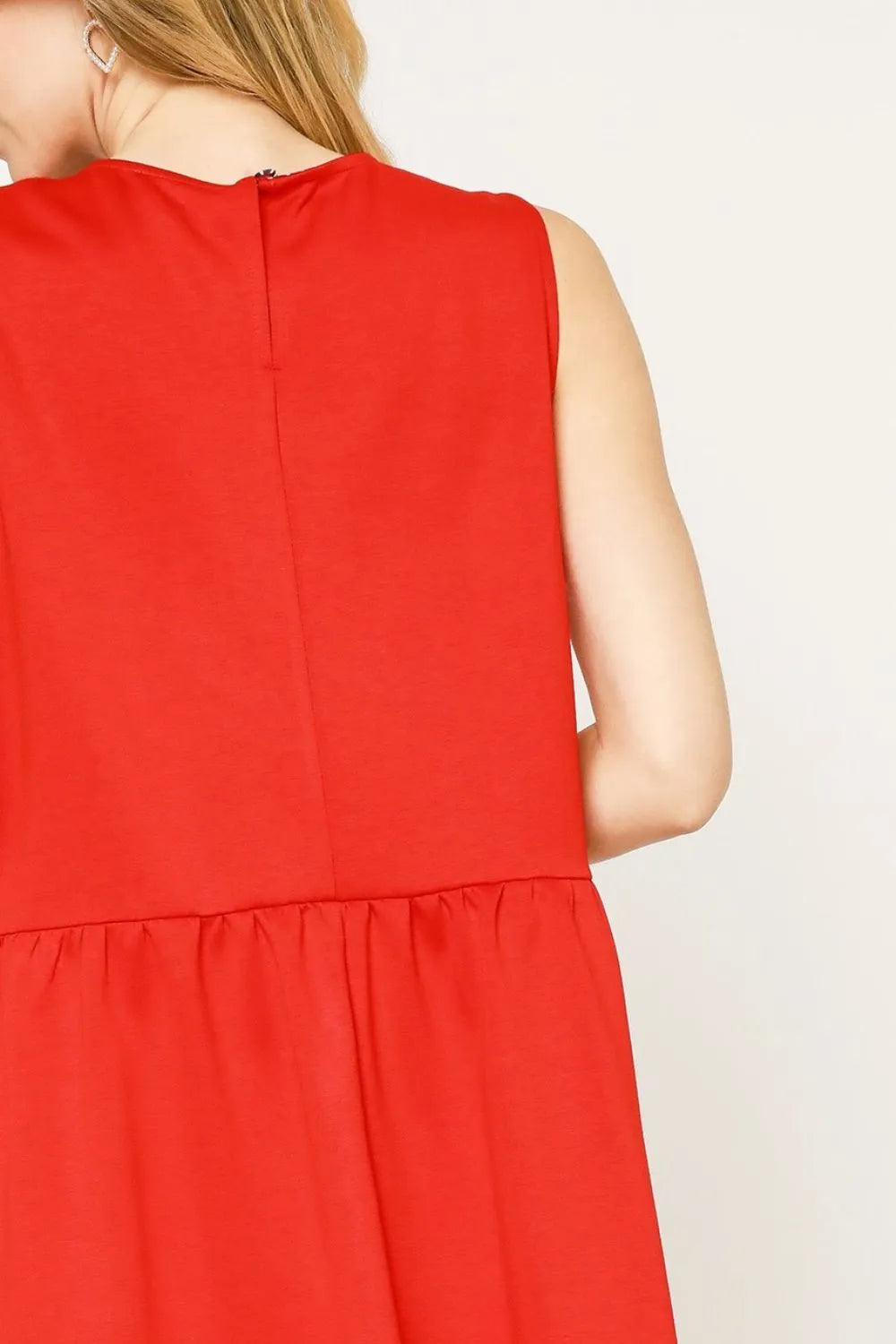 Red sleeveless tank dress back view with plain bodice and gathered skirt hem
