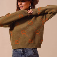 Olive crewneck pumpkin sweater with orange rhombus pattern, relaxed long sleeves