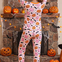 Dusty pink pumpkin-print long-sleeve pajama set with orange trim and matching jogger pants
