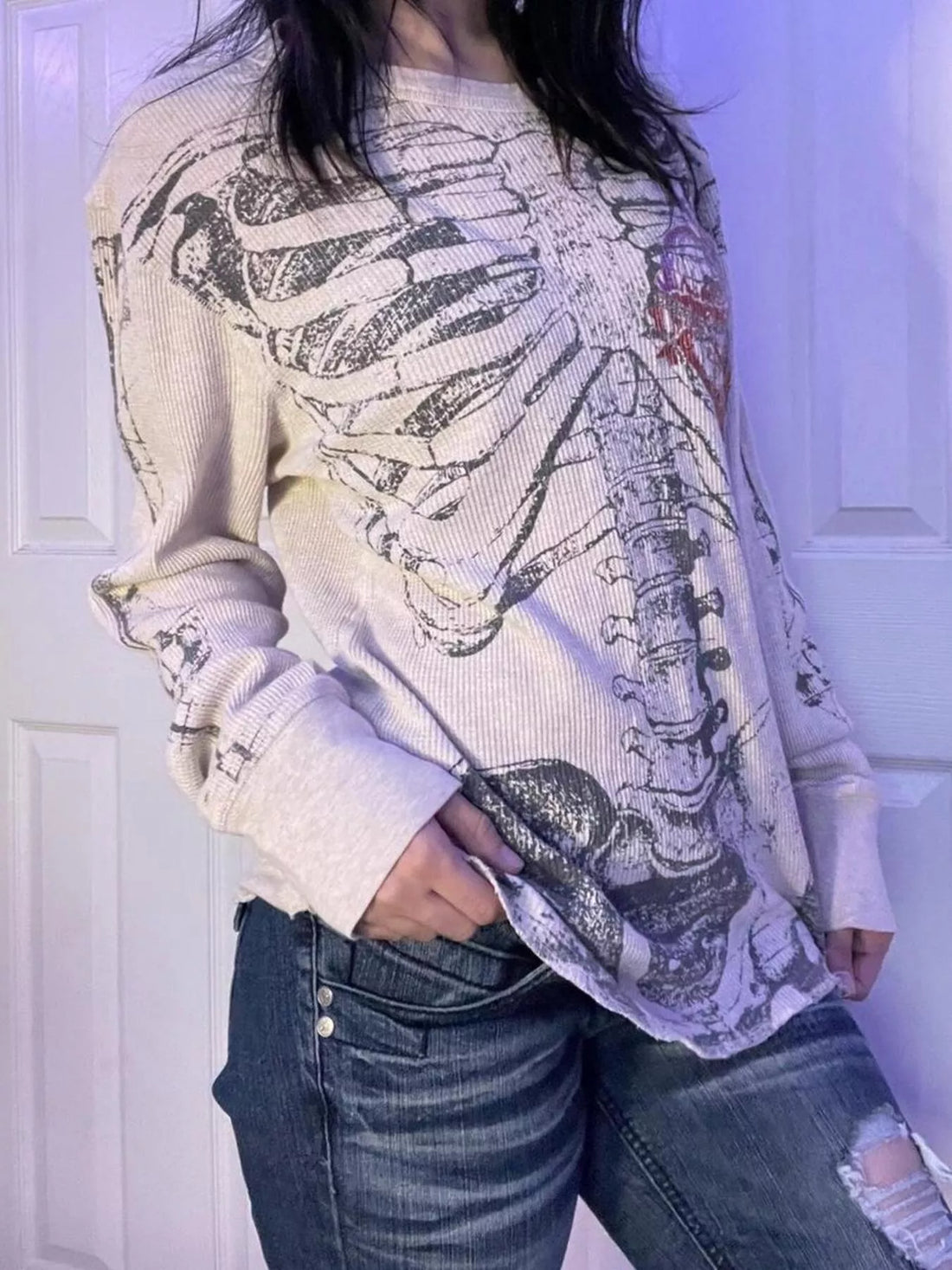 White long sleeve t-shirt with large skeleton graphic and crew neckline