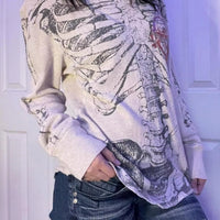 White long sleeve t-shirt with large skeleton graphic and crew neckline