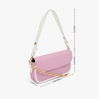 Pastel pink mini crossbody bag with flap front, gold chain strap, and white handle