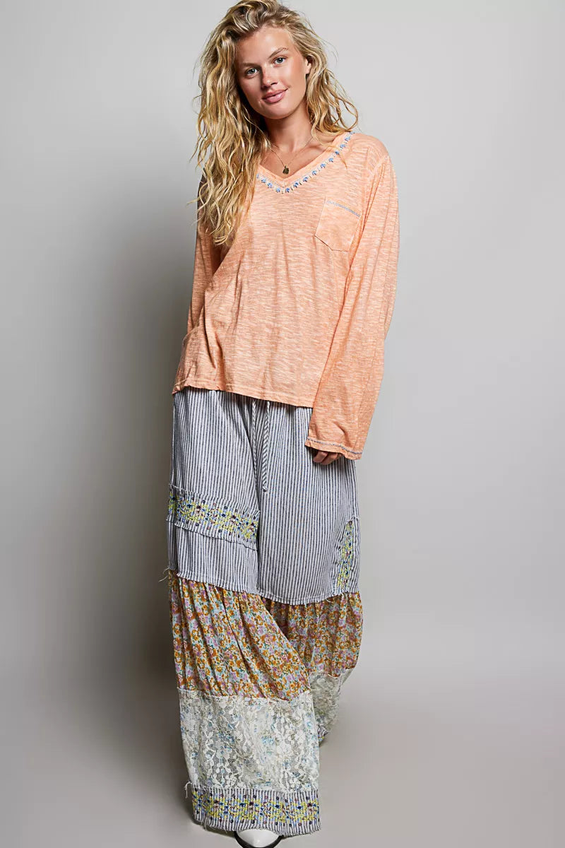 Peach V-neck lightweight knit long-sleeve top with contrast trim