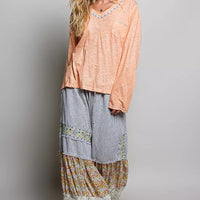 Peach V-neck lightweight knit long-sleeve top with contrast trim