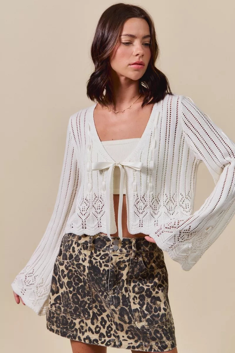 Off-white textured open-front ribbon-tie cardigan with long wide sleeves