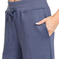 Blue indigo wide-leg pants with drawstring waist and center seams