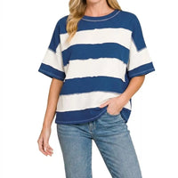 Navy and white striped French terry top with exposed seams and wide short sleeves